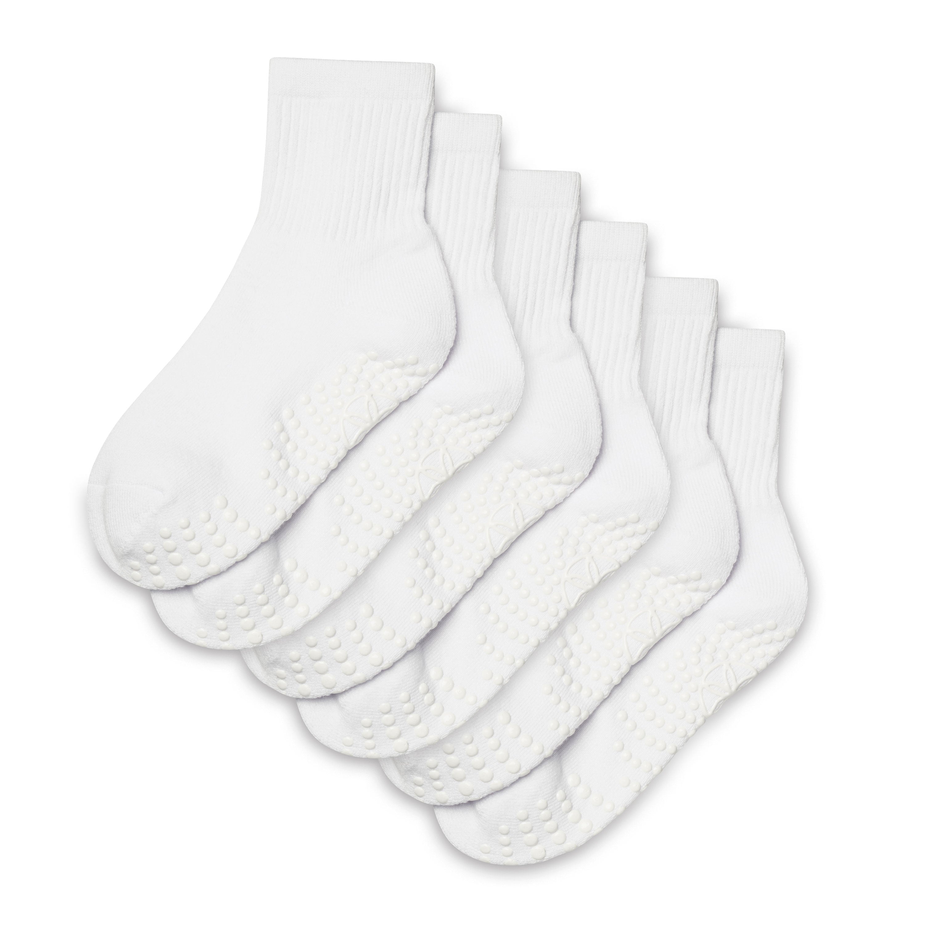 Set of five white socks with textured sole on a white background